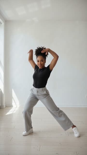Step 3: the wide lunge with both arms up, from our sample